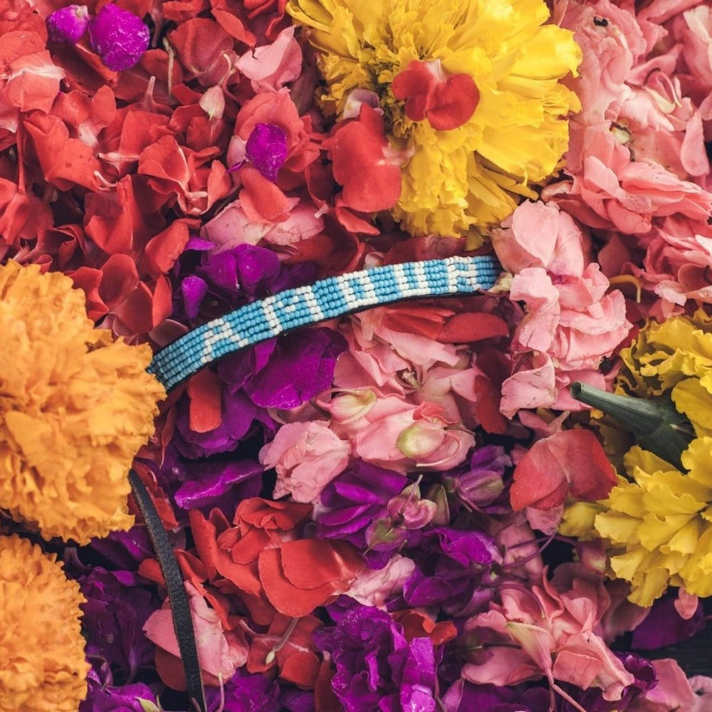 An AMOUR Bracelet in flower petals - Love Is Project