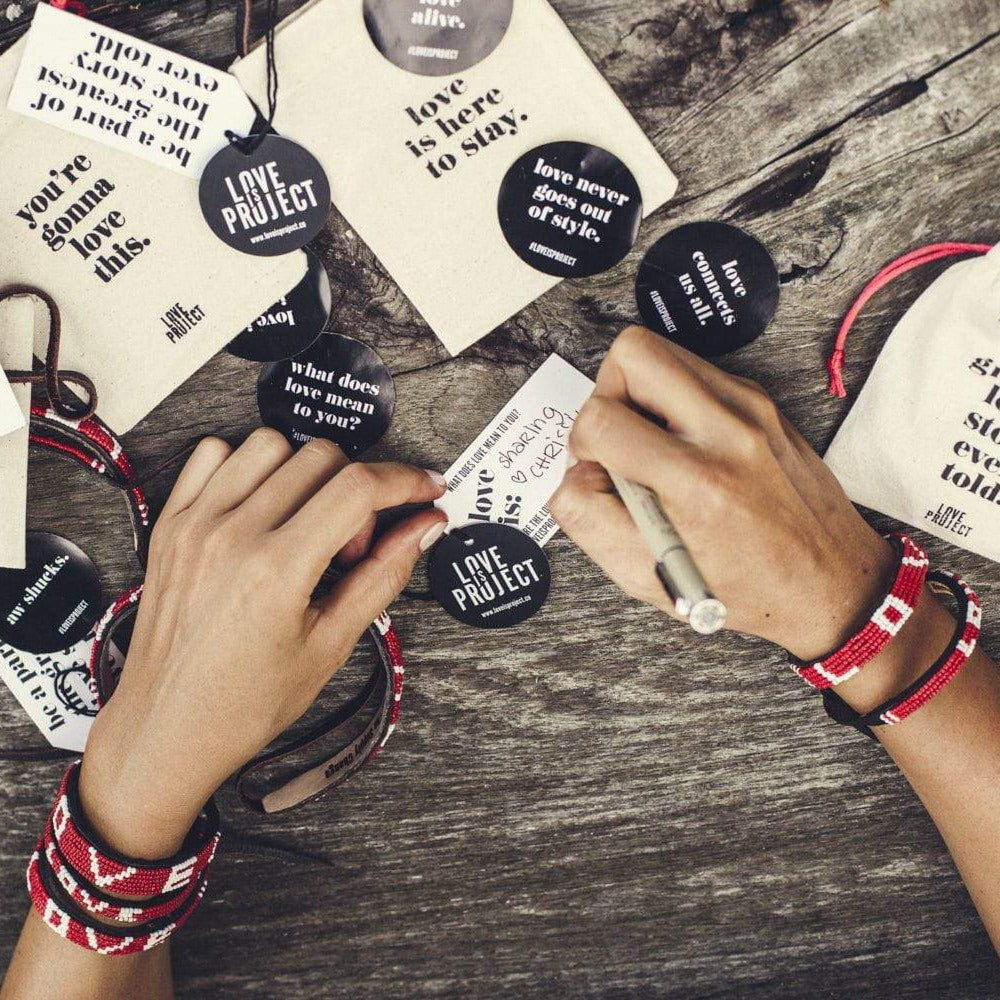 All Love Is Project bracelets come with stickers
