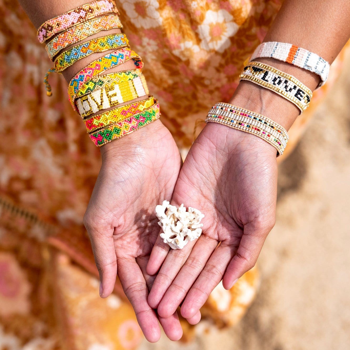 A model wearing the Jungle Bali Friendship Bracelet Bundle from Love Is Project