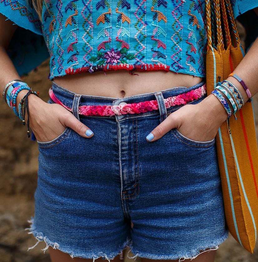 A model wearing the Blue, Turquoise, and Indigo Atitlan LOVE Bracelet from Love Is Project