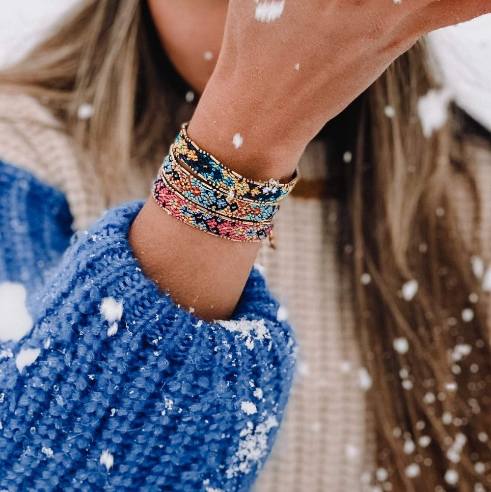 A model in the snow wearing the Coastal Bali Friendship Bundle from Love Is Project