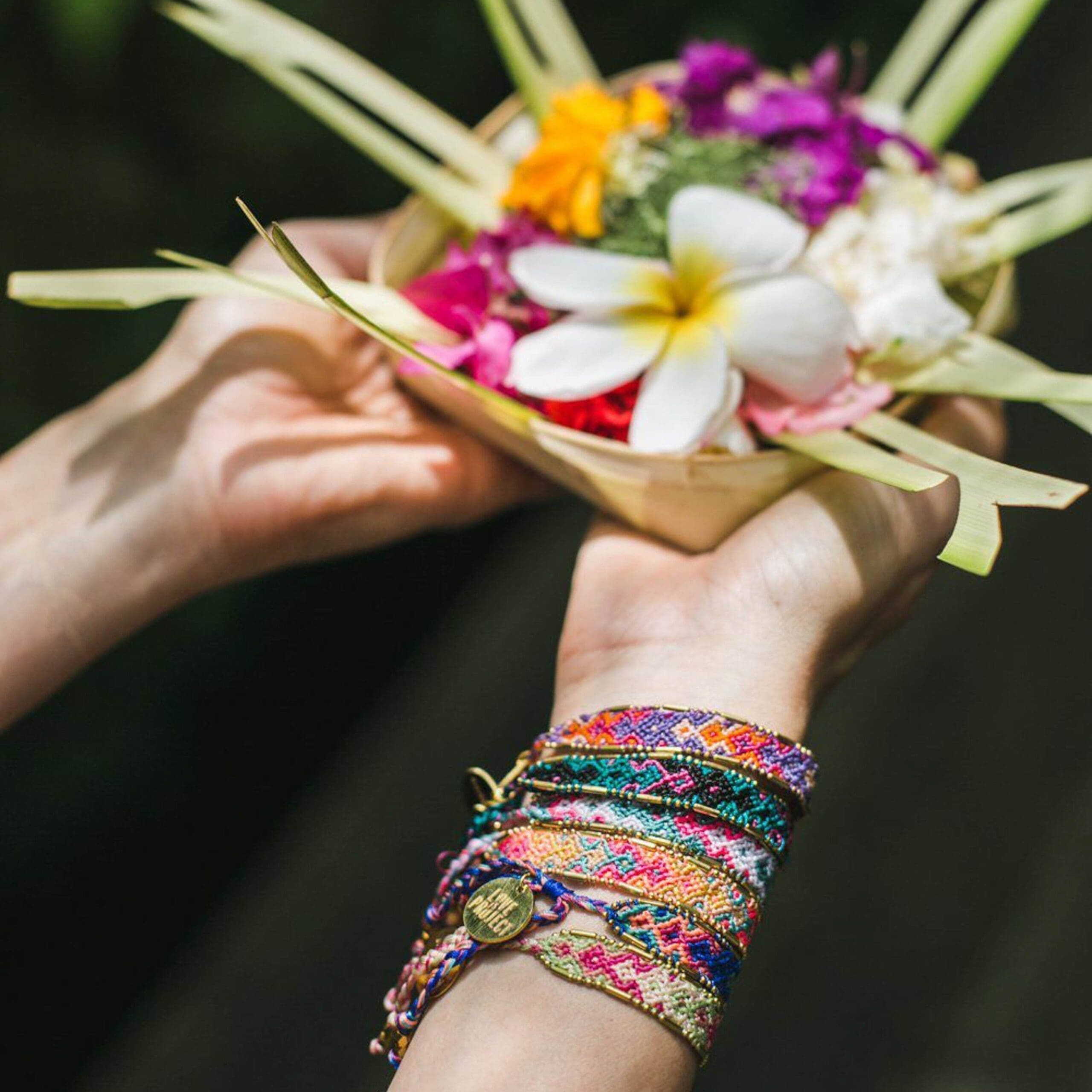 Bali Friendship Bracelets arm stack Love Is Project woven bracelets by artisans in Indonesia. Glass Beaded bracelets creates jobs.