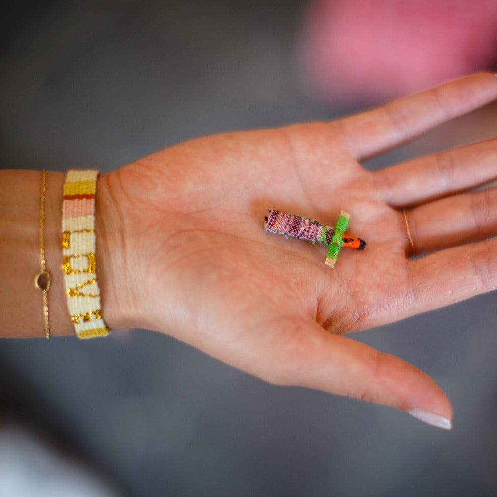 Every Atitlan LOVE Bracelet comes with a Guatemalan worry doll