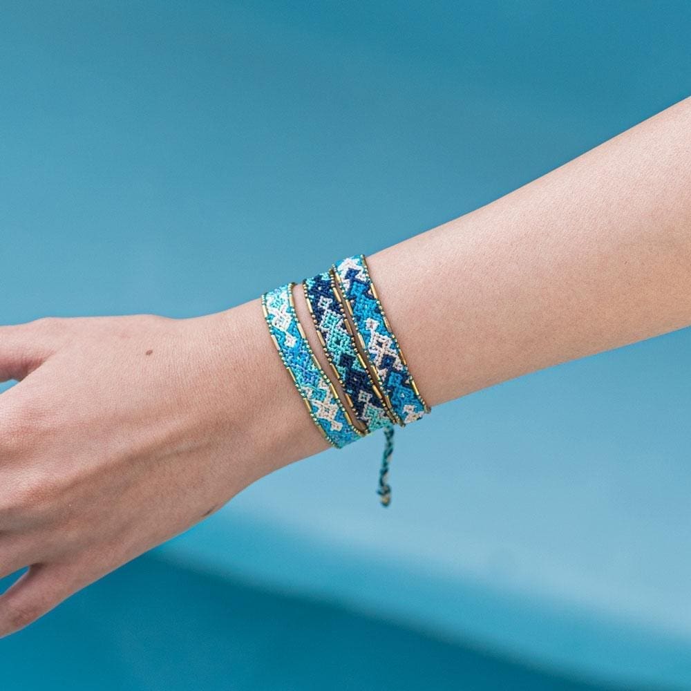 A model wearing the Ocean Bali Friendship Bracelet Bundle from Love Is Project