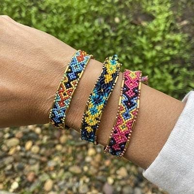 A model wearing the Shark Bali Friendship Bracelet Bundle from Love Is Project
